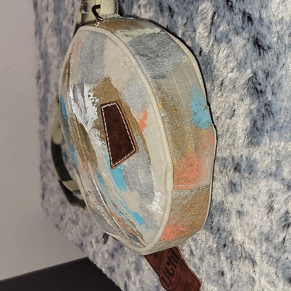 Canvas round crossbody purse. Has splashes of color. - Picture 7 of 10